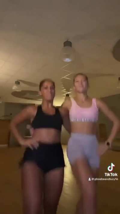 Two ladies treat us to a kick-line