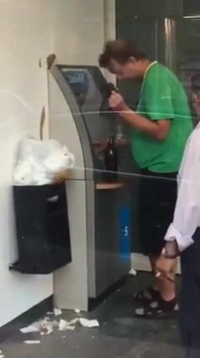 Trying to use the ATM.....drunk AF.