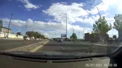 Runaway tire bounces straight for the hood of a woman’s car. It bounces over her instead.