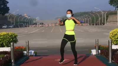 This woman from Myanmar was recording her aerobics class. Unbeknownst to her, she records the military Junta arriving to the parliament for a coup d'etat in the background