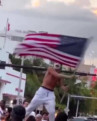 Paints face and hair like the Joker, goes to South Beach, climbs up on a car with an American flag, screams “Fucking COVID is over baby!” and makes it rain.