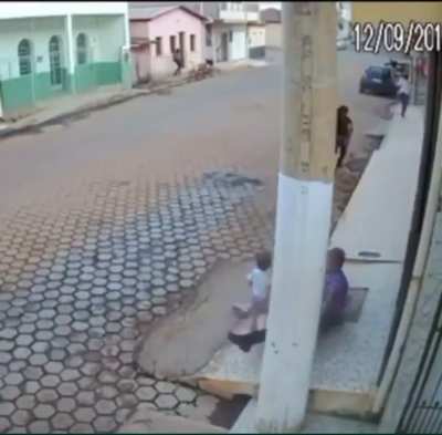 To make a hit on a man standing with his family