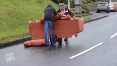 Two Irish Men Attempt to Move a Sofa