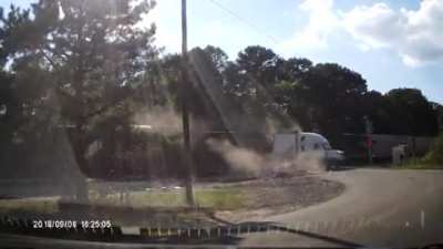Train cuts through a semi