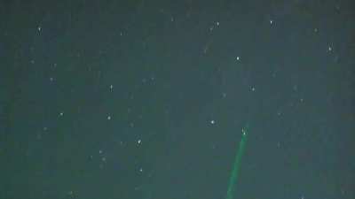UFO makes a sudden turn after being struck by a laser pointer in Big Bear Lake, California.
