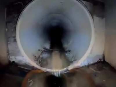 On a motorcycle through drainage tunnels