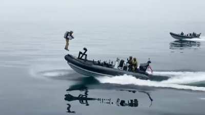 Royal Marines fly over sea in jet suits