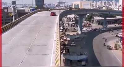 Speeding car fall from Bridge