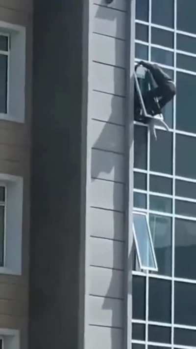 The man climbed out of his eighth floor apartment window to catch the helpless three-year-old girl.