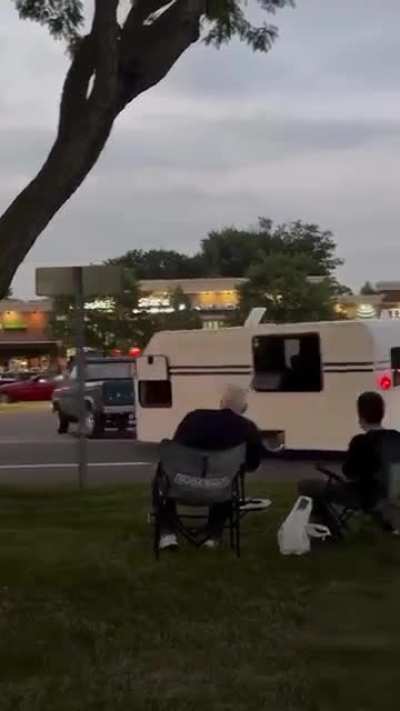 A guy converts his pickup and trailer to appear like it's driving in reverse :