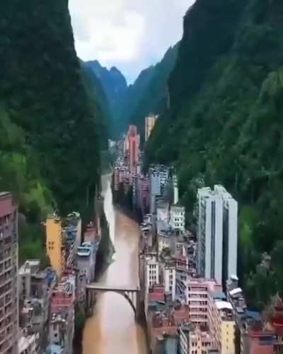 A magic city with cliff vegetation on both sides, Yanjin Zhaotong China