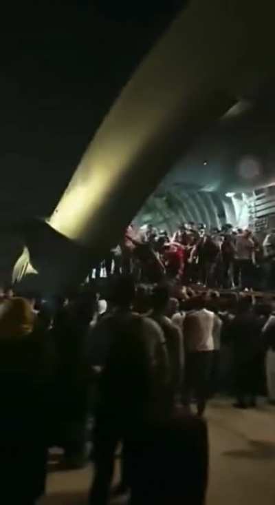 This is just sad. People climbing into a military plane to leave Kabul.