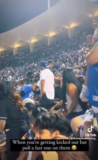 Saw on TikTok. Dodger fan pulls fast one while getting kicked out.