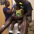 Dad gets (pretend) vaccinated so daughter will be less scared getting her shots.