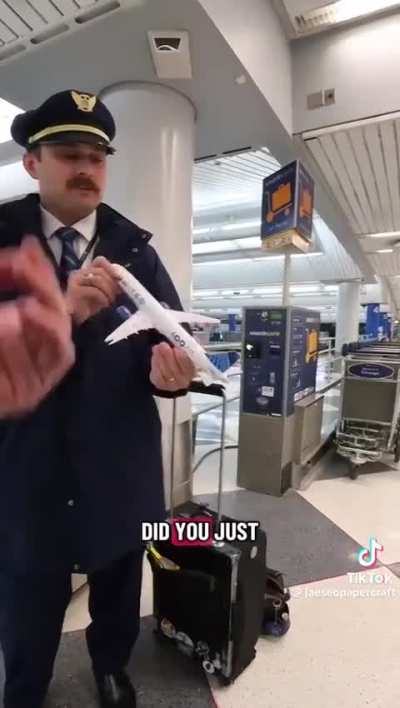He gave a United pilot a paper airplane.