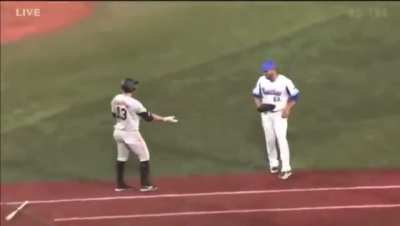 Edwin Escobar high fives Takayuki Kajitani for the out