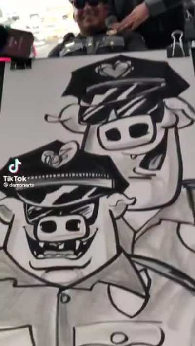 Police officers at a caricature artist