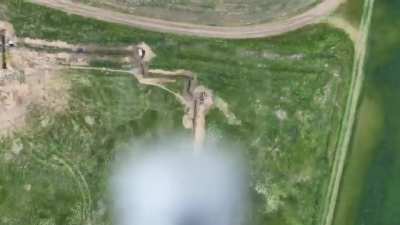 Ukraine's 59th Brigade filmed this grenade drop onto a Russian trench from a drone that despite being noticed manages a direct hit.