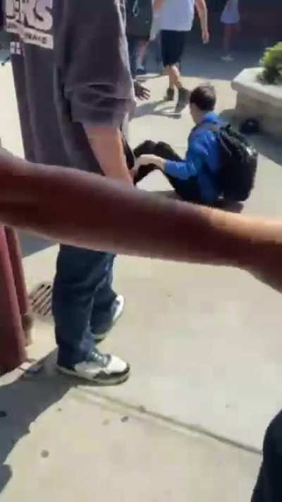 Kid in Blue was talking shit so the kid in white slapped him and they started fighting