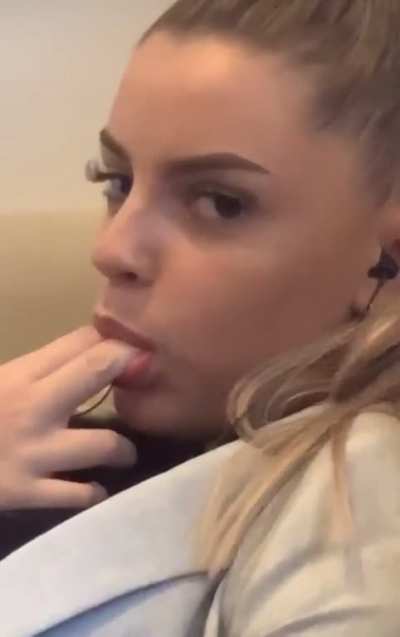 Sucking her fingers