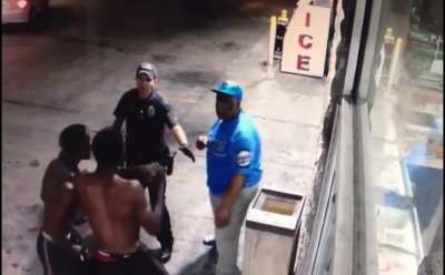 Security guard pepperspraying to break up a fight