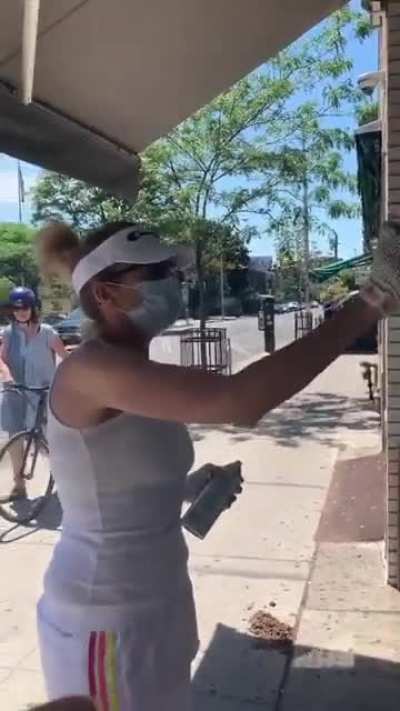 Racist women spray paints over “I love gaza” sign. In attempt to silence the criticism of Israel.