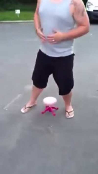 Big man sitting on little chair