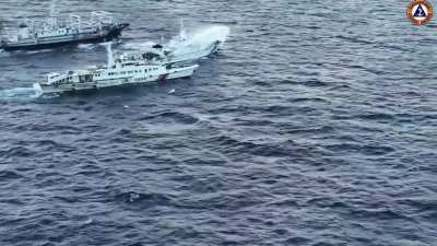 Chinese Coast Guard vessel 5204 blasts  water cannons towards a Philippine Coast Guard M/L Kalavaan supply vessel and a UM1 boat, as they try to approach the Avungin shoal for a resupply mission, causing severe damage to M/L Kalavaan's engines and causing