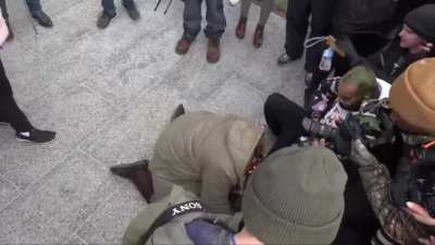 Protestor not happy with Rittenhouse verdict falls to the ground and says Fuk America. Fakes seizure. 😂😂