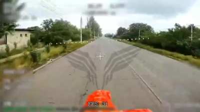 RU POV: Russian drone flies over the road with no civillians caring about it.