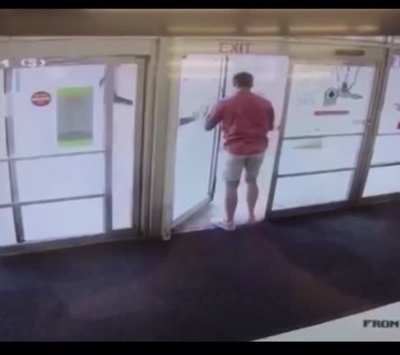 the exit sign is above a hinged door when there is a sliding door next to it