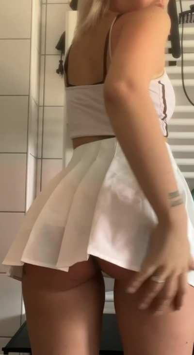 skinny girl with juicy ass in a skirt