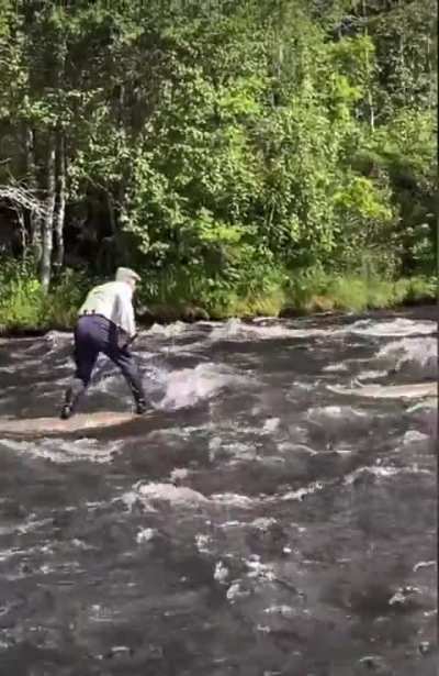 Older log-rider navigates a rapid stream. This is a different skill.