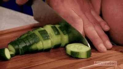 Iranian chef chopping a cucumber before the Islamic revolution. (Circa 1972)