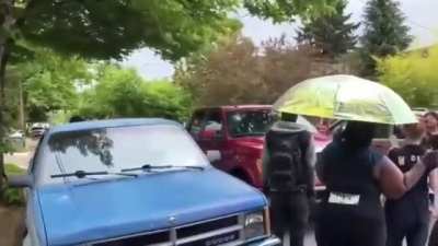 [Hall Of Fame] Antifa/anarcho-leftists illegally marching in the middle of a Portland residential street point guns at a disabled Marine who returns the gesture. Both the Marine and the Antifa group accuse each other of being the aggressor.