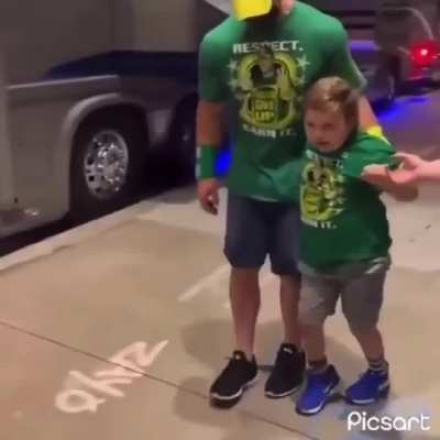 John Cena helps a kid in a wheelchair to get up and walk around with him and his mother ❤