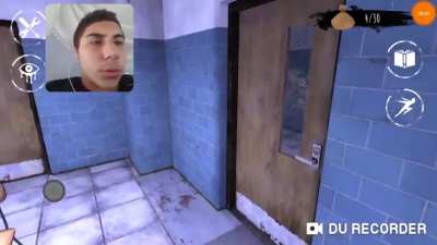 Turkish boy playing mobile horror game