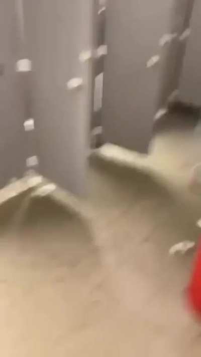 Guy trying to stick a firework in a bottle