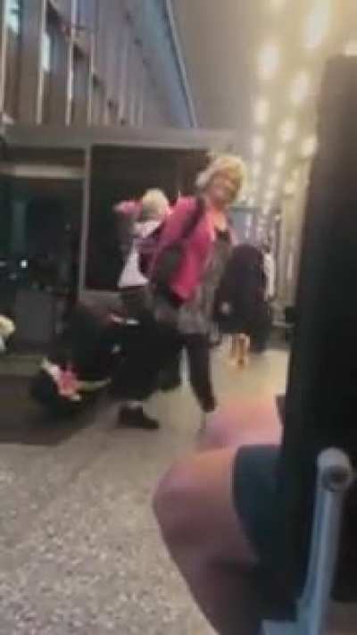 Grandpa waits patiently for his wife at the airport