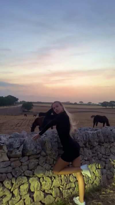 Polina Malinovskaya - Short Black Dress in a Windy Countryside Landscape (IG Story Clip)