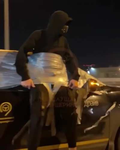 In Russia extra passenger goes on the outside with the aid of a little tape