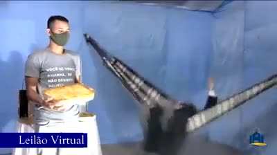 Just a priest auctioning a lasagna while swinging on a hammock
