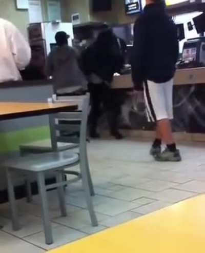 McDonalds cashier in Greenwich hits two customers with a stick after they slap him and jump the counter