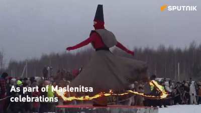 Why are they burning a giant black cube?