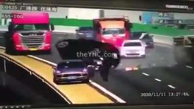 truck hits the car down the bridge.