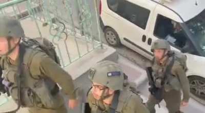 Israeli forces shooting a guy to evict him, scream and shout at the person filming the video