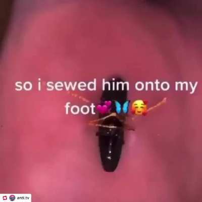 Cursed_ girl sews bug onto foot