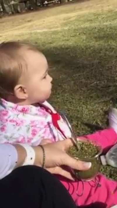 Infant drinking tea for the first time