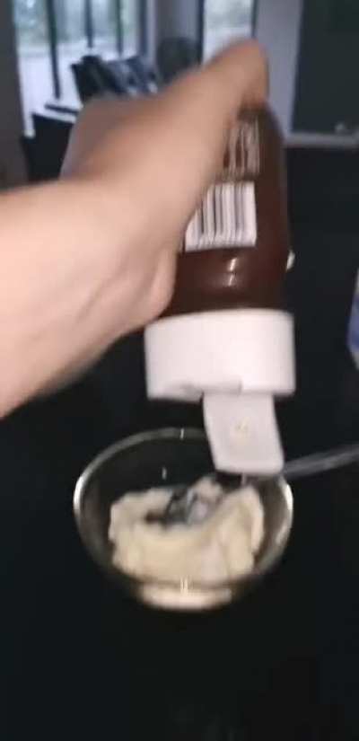 Squeezing honey out of plastic container