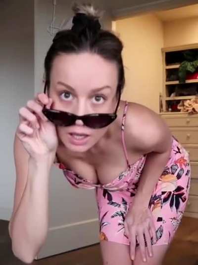 Flashing her cleavage